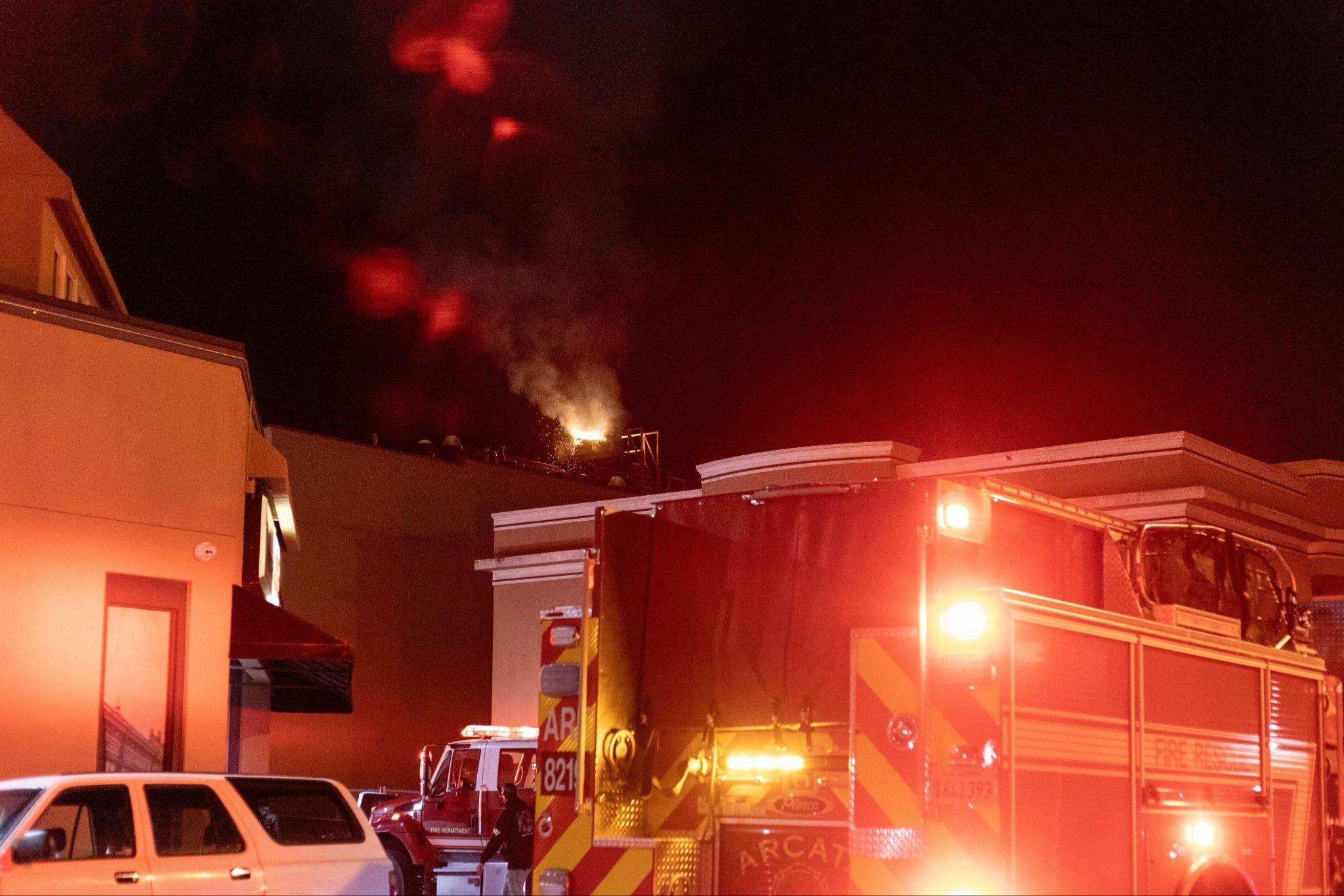 Firefighters responding to a California restaurant fire involving a commercial kitchen exhaust system.